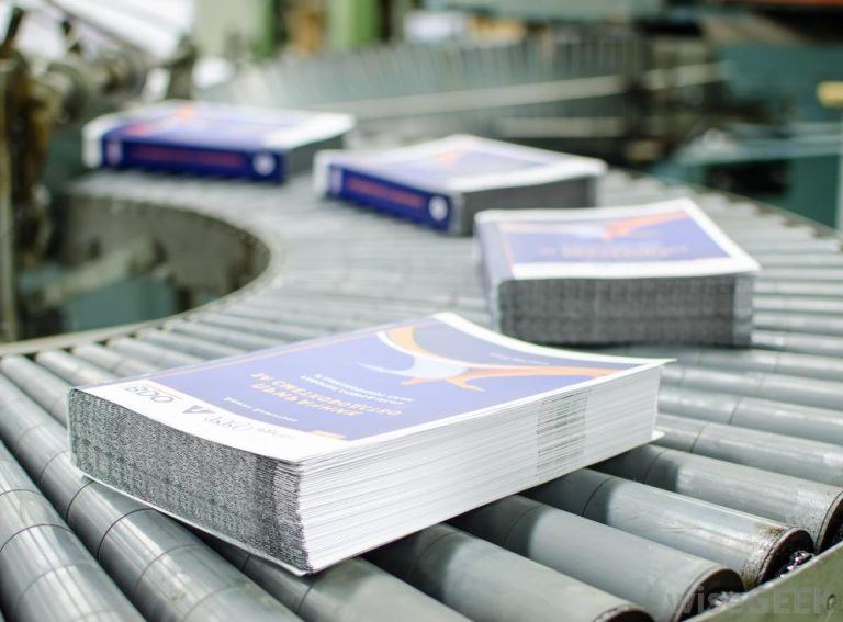 Stack of printed papers on factory machine